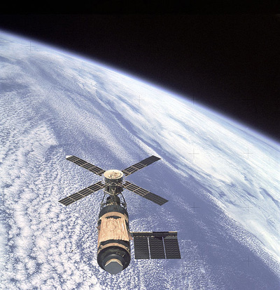 
View of Skylab space station cluster in Earth orbit from the departing Skylab 4 command module.