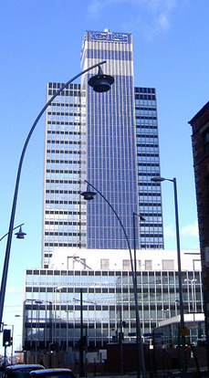 
The CIS Tower, Manchester, England, was clad in PV panels at a cost of £5.5 million. It started feeding electricity to the national grid in November 2005.