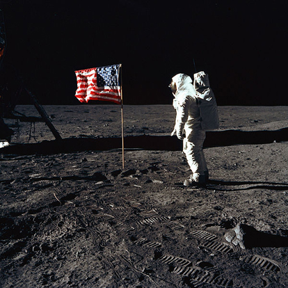 
This image shows Apollo 11 astronaut Buzz Aldrin with the U.S. flag. The illusion of a breeze was caused by the horizontal rod intended to hold the flag flat failing to telescope out completely, thus leaving ripples in the fabric like those seen in a flag in the wind.