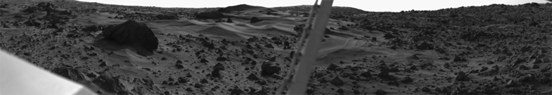 
Dust dunes and a large boulder taken by the Viking 1 lander.