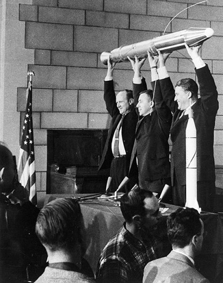 
William H. Pickering, James A. Van Allen, and Wernher von Braun displaying a full-scale model of the Explorer 1 satellite at a crowded press conference held in the Great Hall of the National Academy of Sciences at 1:30 A.M. when it was confirmed that the satellite was in orbit around the Earth.