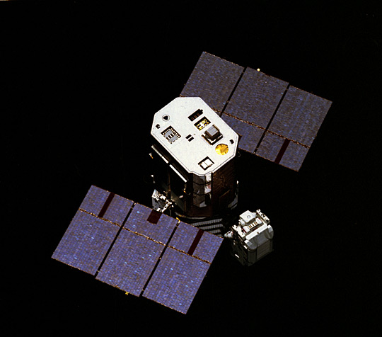 Astronaut with satellite to repair