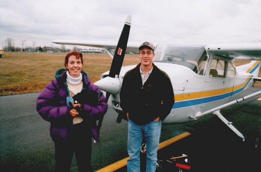 A Canadian aeroplane flight instructor (left) and her student, next to a Cessna 172 with which they have just completed a lesson.