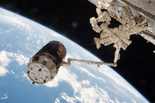 HTV-6 grappled to a robotic arm of ISS