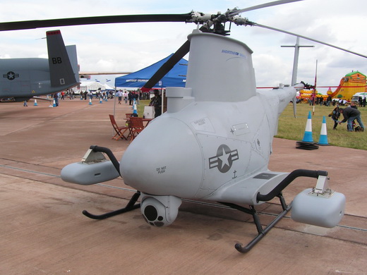 Although most military UAVs are fixed-wing aircraft, rotorcraft designs (i.e., RUAVs) such as this MQ-8B Fire Scout are also used.
