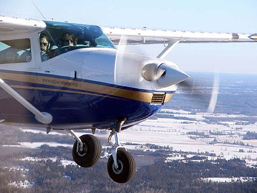 1967 Model Cessna 182K in flight showing after-market vortex generators on the wing leading edge