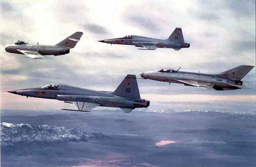 
Two 64th Fighter Weapons Squadron F-5s with a 4477th TEF MiG-17 (leading) and MiG-21 (trailing) in 1979. Note the Tactical Air Command badge applied to the vertical fin of the MiG-21.