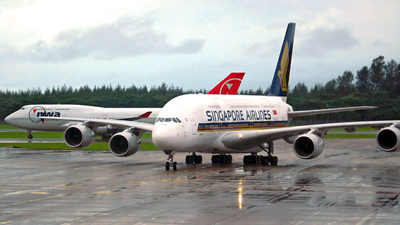 
A Singapore Airlines Airbus A380 and a Northwest Airlines Boeing 747 at Changi Airport.