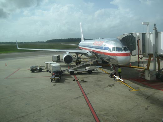 
An American Airlines Boeing 757 undergoing pre-flight service at Piarco International Airport