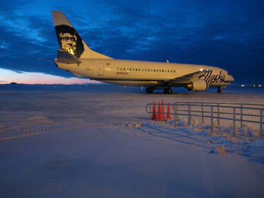 
Alaska Airlines 737-400 combi aircraft on Barrow Airport, December 2007. Note that it is twilight. Even though the sun does not rise in December, it gets close enough to the horizon to illuminate.