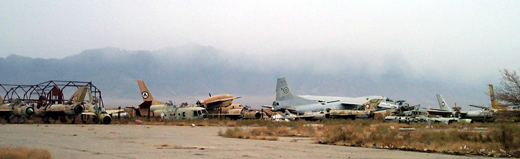 
Destroyed aircraft line the runway, early 2002