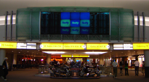 
Main flight information board at the entrance to Concourse B