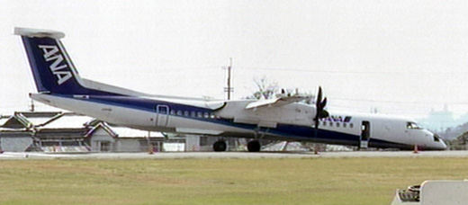 
All Nippon Airways Flight 1603 plane makes a belly landing at Kochi Airport on 13 March, 2007 after the front landing gear fails to deploy.
