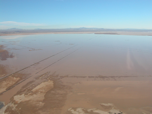 
Rogers Lake isn't always dry. During the brief rainy season in the Mojave Desert, water still fills the lake bed. The compass rose can be seen on the left in this image.
