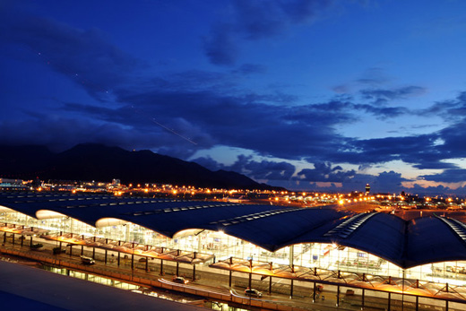 
The exterior of Hong Kong International Airport at night-time