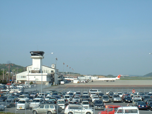 
A view of the Okayama Airport terminal and control tower from the parking lot