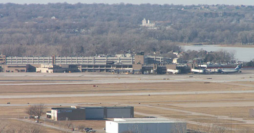 
Eppley Airfield terminal in Omaha. The houses immediately behind are in Carter Lake, Iowa (with Carter Lake visible to the right). The bluffs are in Omaha.