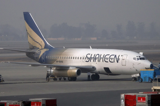 
A Shaheen Air Boeing 737-200 being serviced at a remote stand