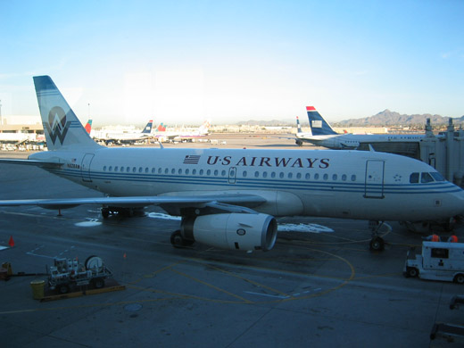 
A US Airways Boeing 757-200 and other aircraft in line for departure on Runways 7L and 7R.