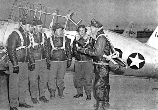 
Flying cadets at Walnut Ridge AAF in front of a Vultee BT-13A Valiant, 1943 (Serial 41-23074 visible)