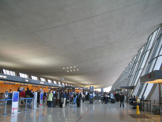 
The terminal ceiling is suspended in a catenary curve above the luggage check-in area.