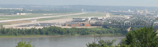 
The airport from Quality Hill. The Broadway Bridge (Kansas City) is on the right. The Fairfax Assembly plant (the former Fairfax Airport) is the big building across the Missouri River on the left.