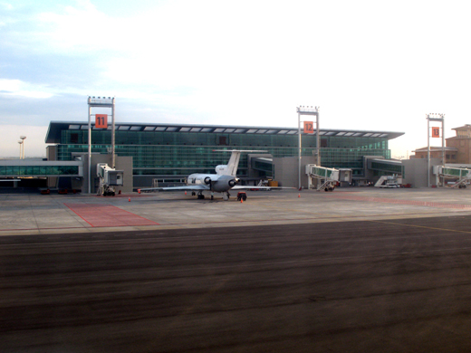 
New terminal with an Alania Airlines Yak-42 parked at gate