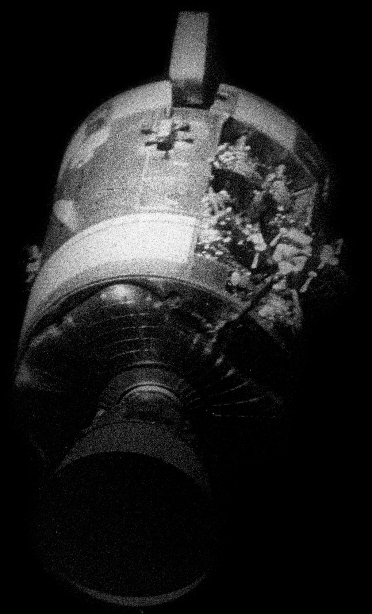 Odyssey's damaged service module, as seen from the Apollo Lunar Module Aquarius, hours before reentry Odyssey's damaged service module, as seen from the Apollo Lunar Module Aquarius, hours before reentry