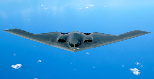 A U.S. Air Force B-2 Spirit flying over the Pacific Ocean in May 2006
