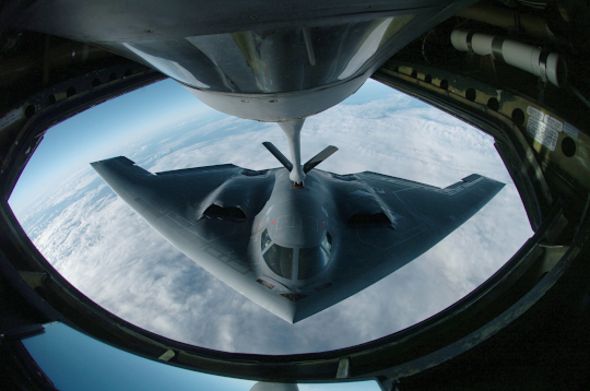 A B-2 during aerial refueling which extends its range past 6,000 nautical miles (6,900 mi; 11,000 km) for intercontinental sorties