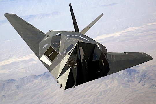 F-117 flying over mountains in Nevada in 2002