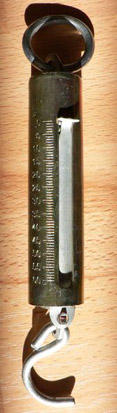 
A spring scale measures the weight of an object