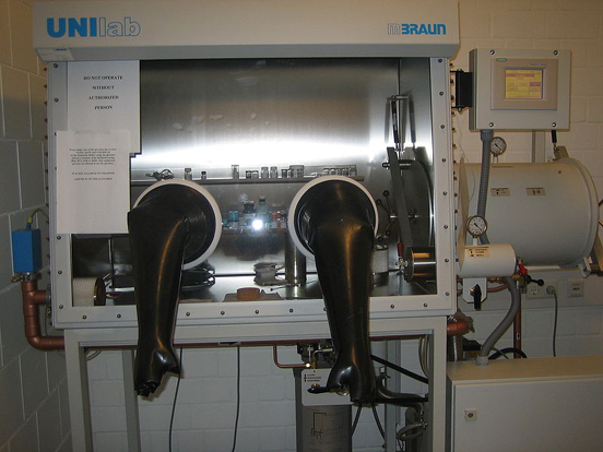 
A glovebox for handling air-sensitive substances. Two airlocks (one small and one large) are attached to the right for moving samples in and out without disturbing the atmosphere inside.