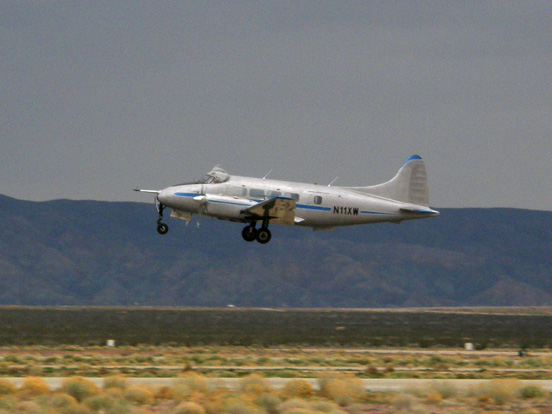 
Dove 6A belonging to the National Test Pilot School departs the Mojave Airport