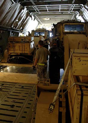 
Excavators in the rear of a C-5. Aerial porters must ensure weight distribution is balanced before takeoff.