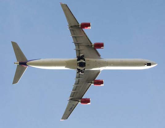 
Planform view of a Virgin Atlantic A340-600 take off. The undercarriages are still retracting.