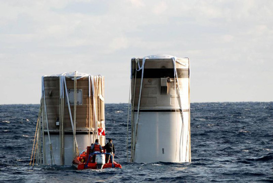 
The solid rocket boosters, jettisoned from the Space Shuttle Discovery following the launch of STS-116, floating in the Atlantic Ocean about 150 miles north east of Cape Canaveral.