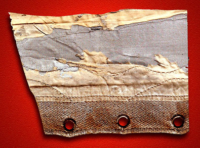 
A portion of the damaged fabric covering removed from the 