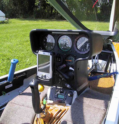 
Single-seat glider cockpit, with a forward hinged canopy in the open position. Click on the image for a description of the instrumentation.