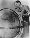 
Juan Trippe, the founder of Pan American World Airways, surveying his globe. The collapse of Pan Am, an airline often credited for shaping the international airline industry, in December 1991 highlighted the financial complexities faced by major airline companies.