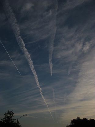 
Series of decaying contrails from successive aircraft travelling to the same destination.