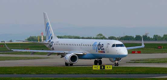 
Embraer 195 taxis at Manchester International Airport. UK