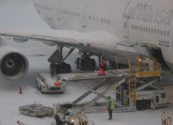 
Loading luggage onto a Boeing 747 at Boston Logan Airport, during a closure due to heavy snow